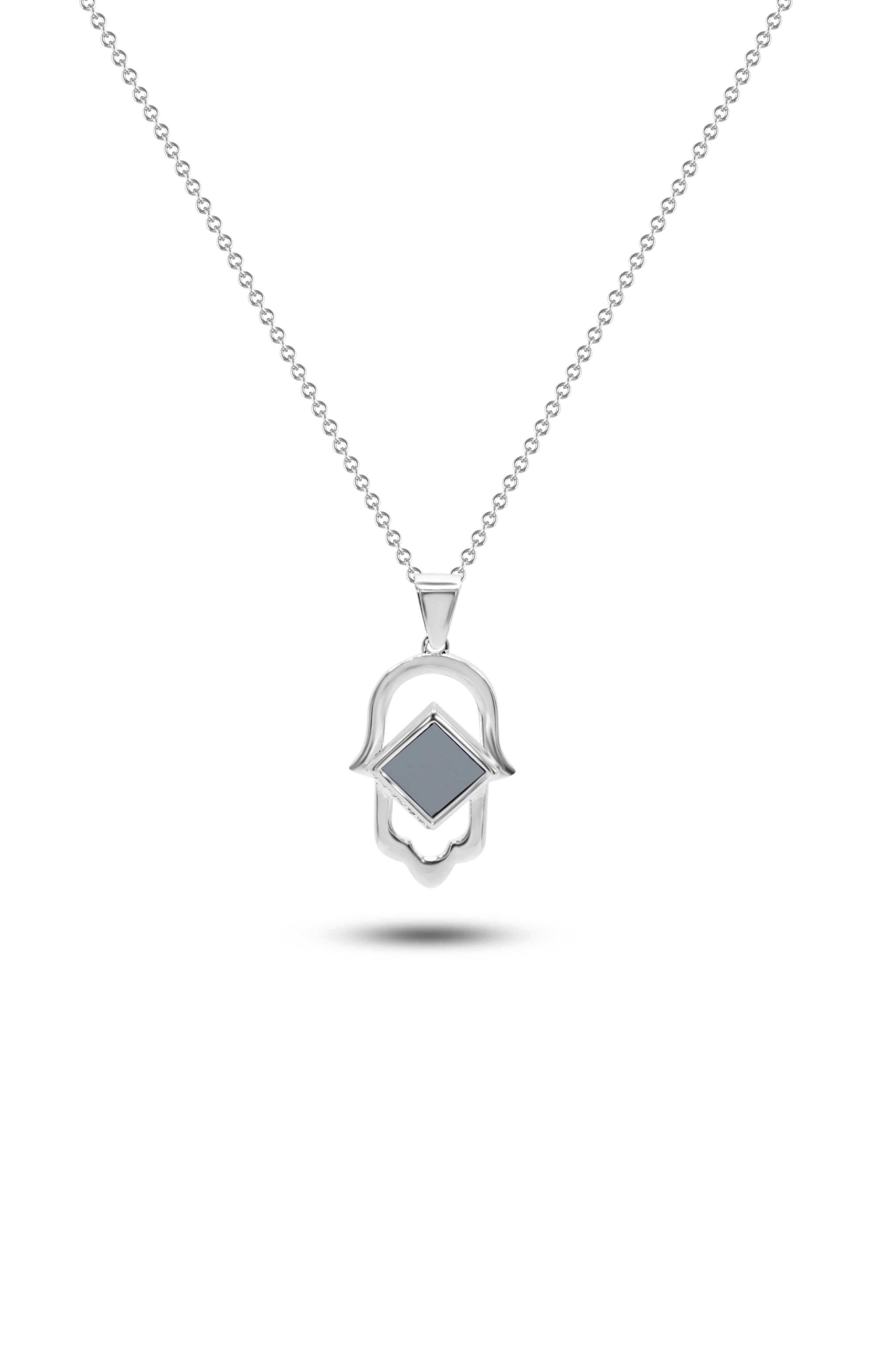 The Basic Hamsa is a silver necklace with a Hamsa hand-shaped pendant featuring a nano chip at its center, displayed on a plain white background—an elegant piece showcasing Nano Jewelry craftsmanship.