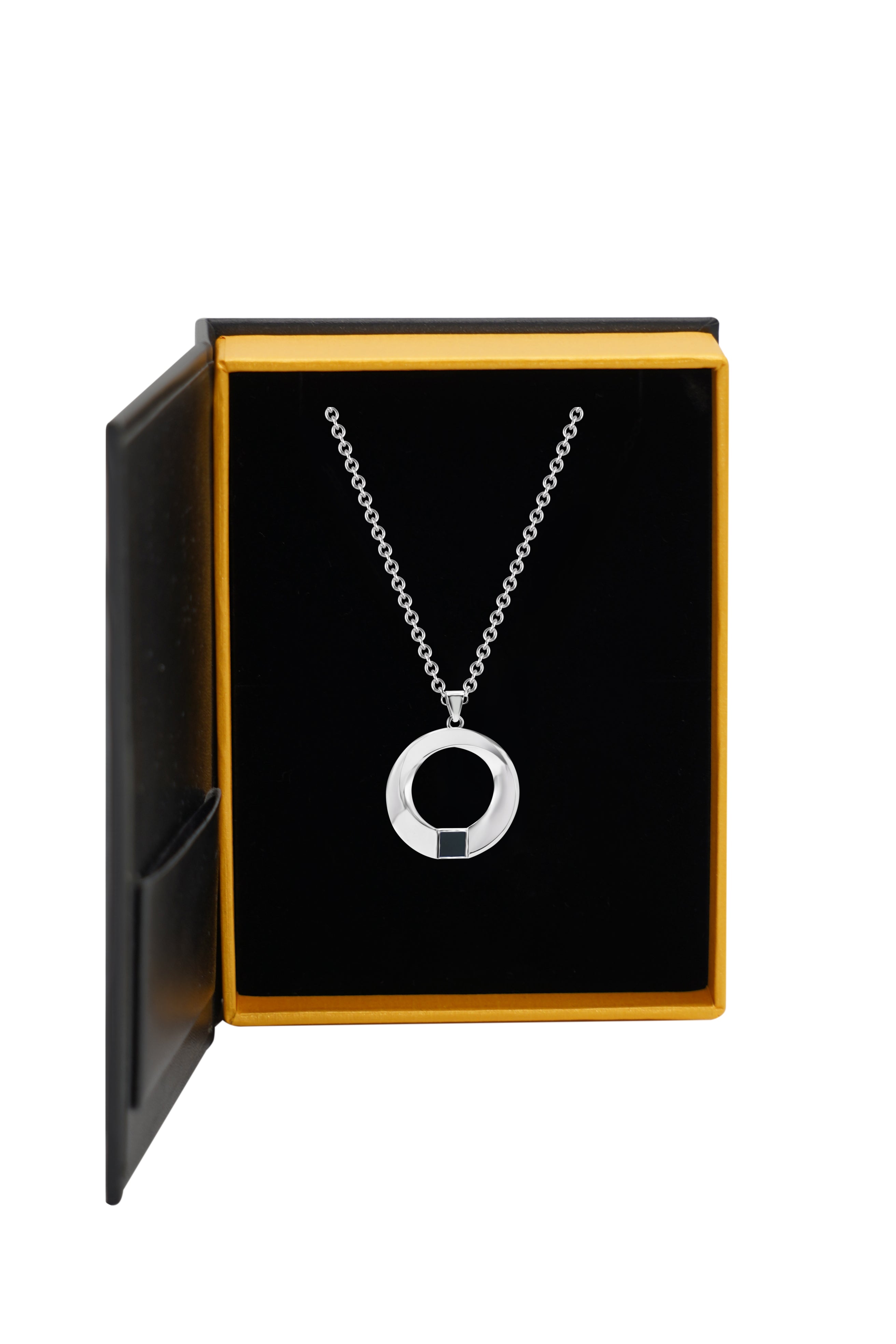 The Eternity Circle Necklace features a silver chain with a circular pendant and small black square accent, echoing Nanochip style, displayed in an open black and yellow jewelry box with a black velvet interior.